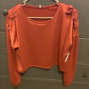 Cropped long sleeve sweater.